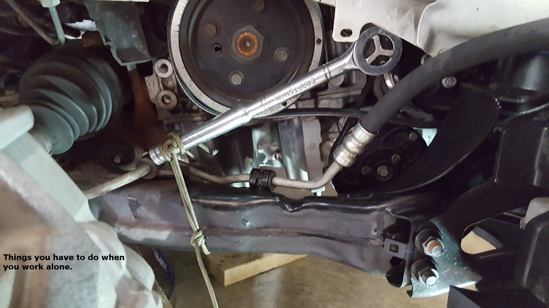 ’12 Volvo S60 AC Compressor Change Turning a wrench