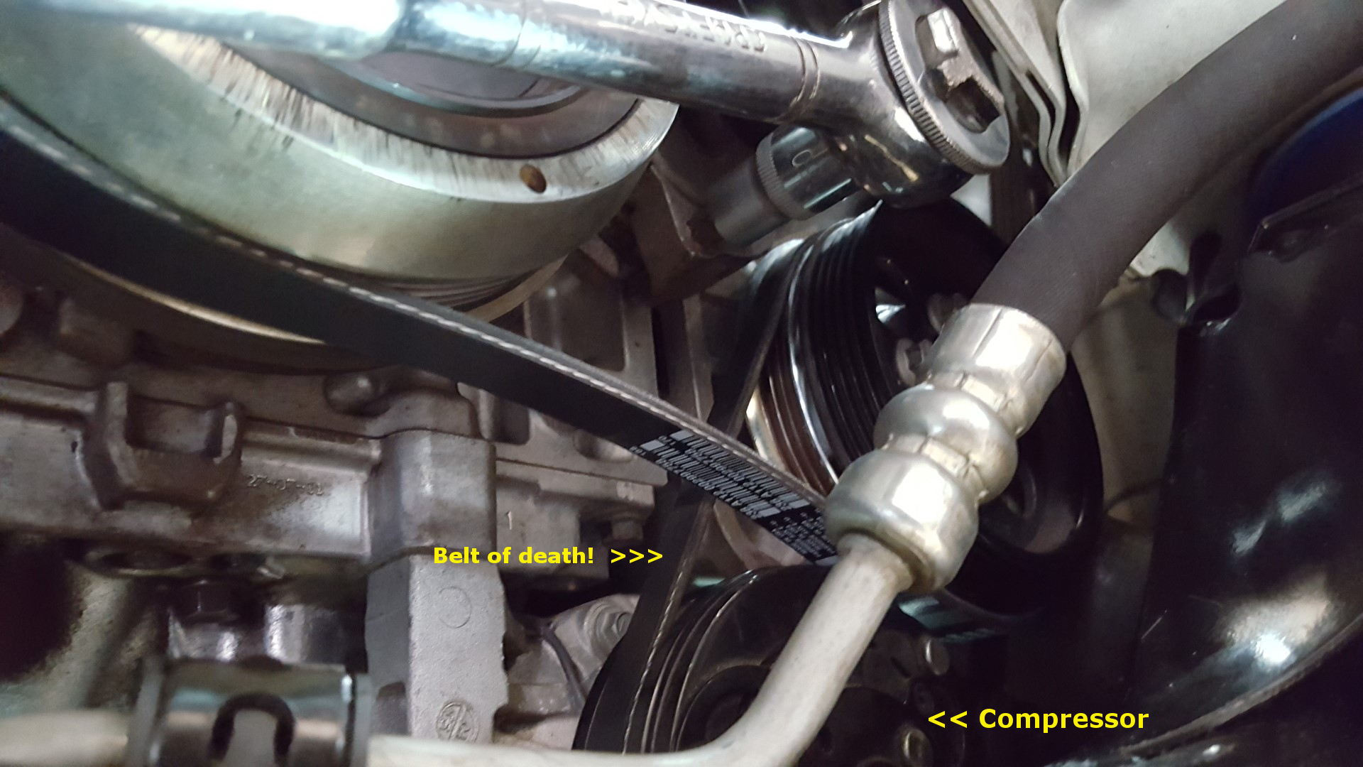 ’12 Volvo S60 AC Compressor Change Turning a wrench